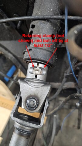 New intermediate steering shaft not fully engaging the upper column shaft, retaining clamp gap visible