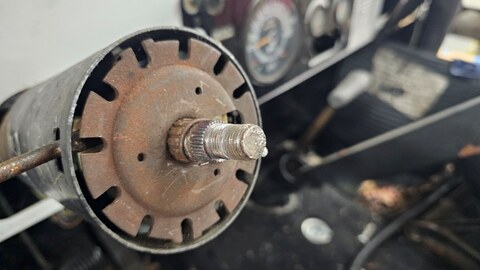Old upper steering column shaft removed, showing splined and worn end